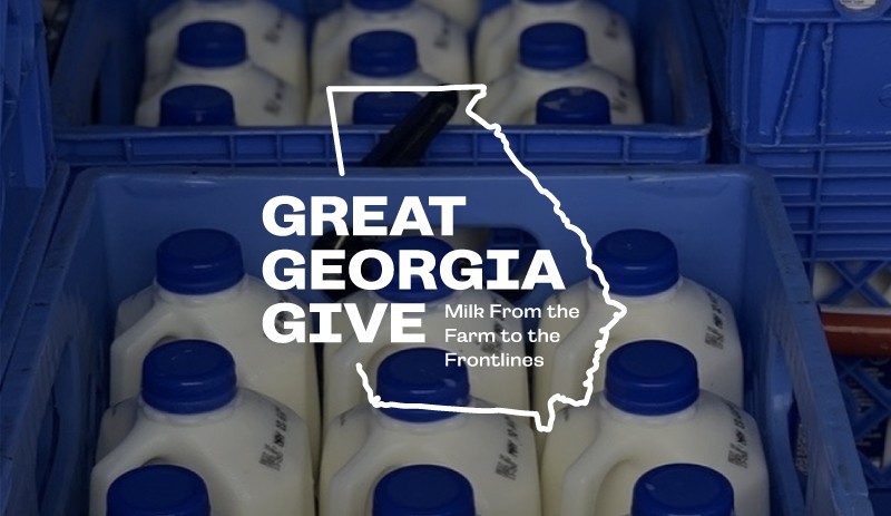 Great Georgia Give logo over a crate of milk